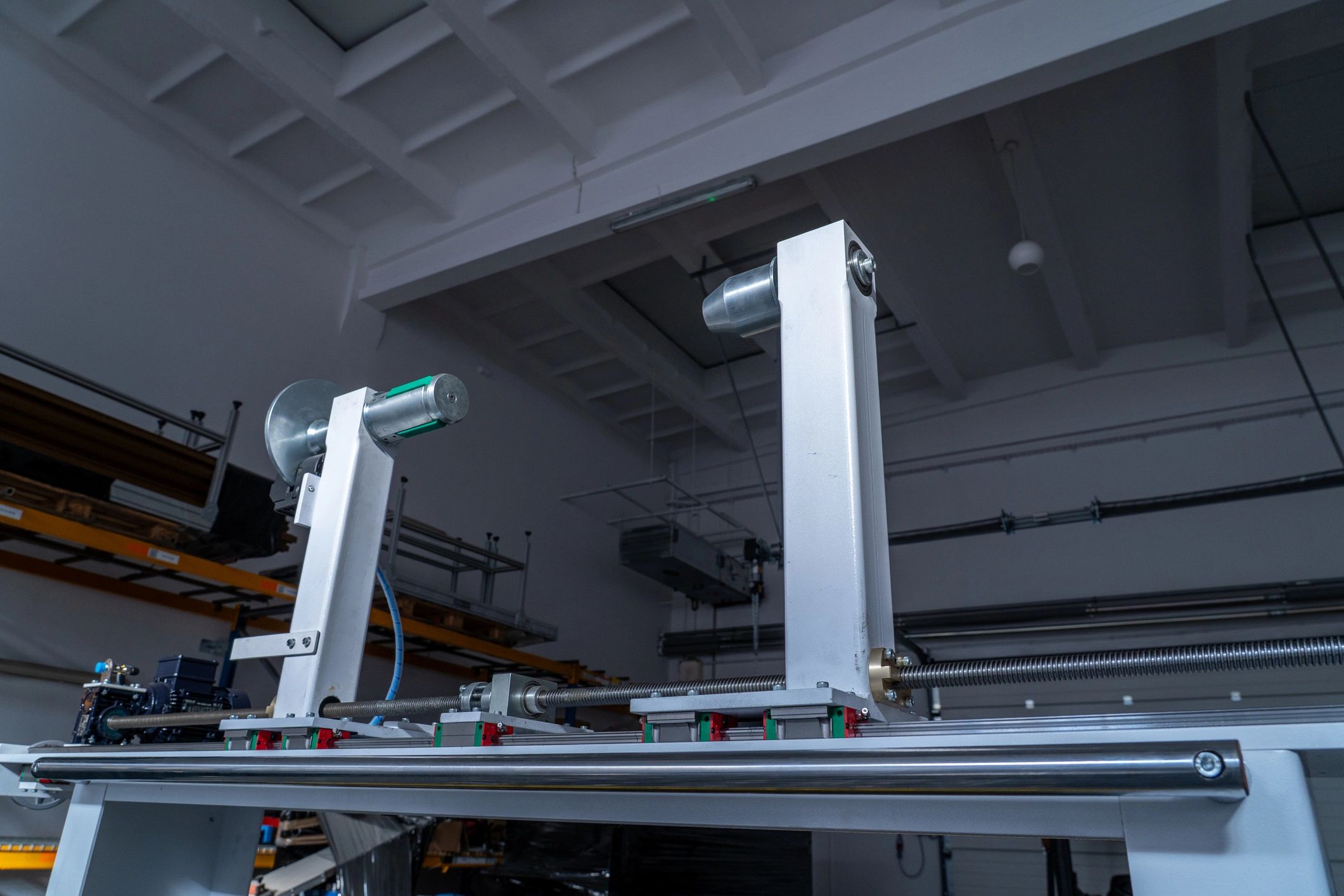 Industrial precision slitting equipment in a factory workshop