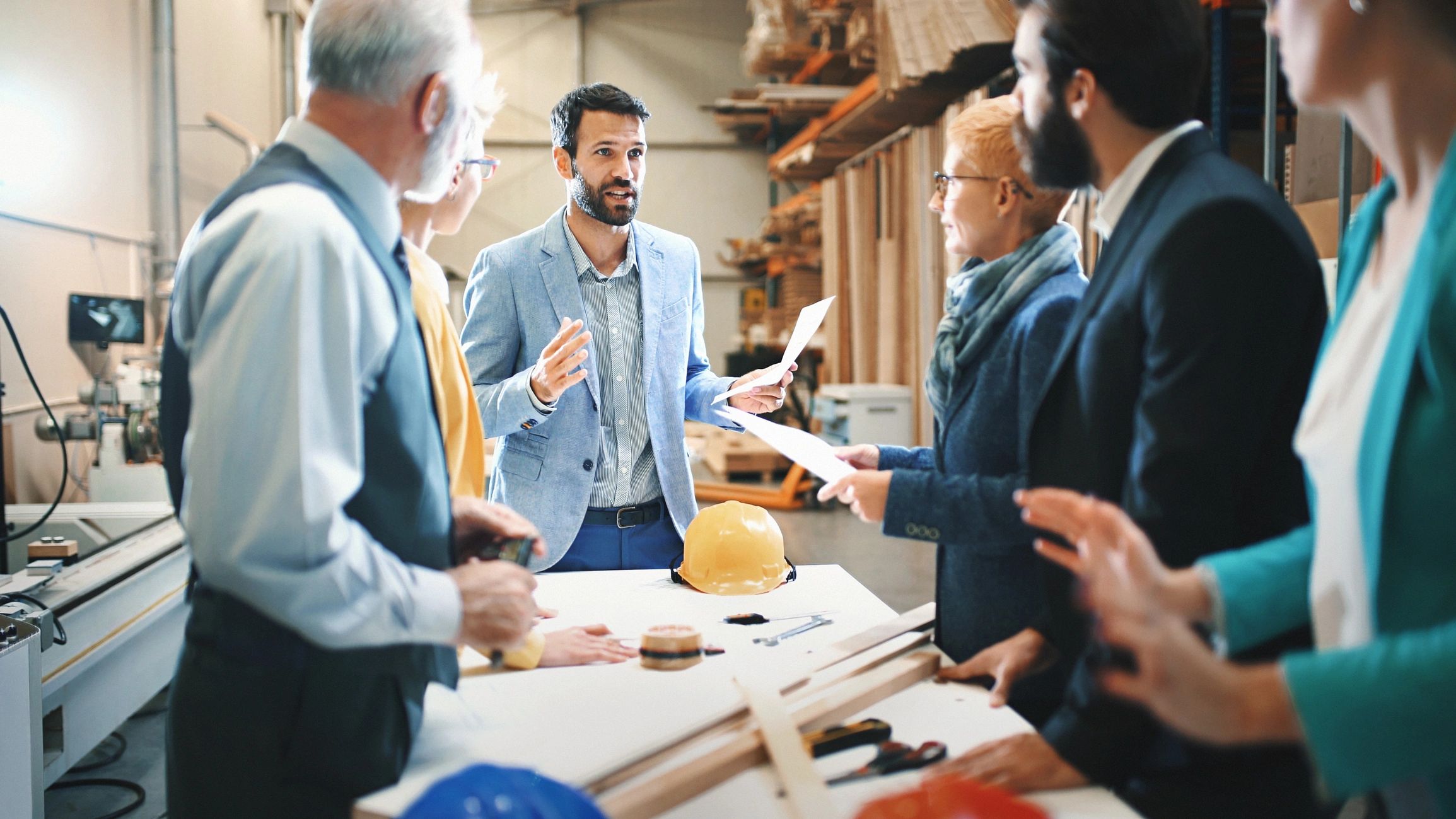 Industrial design team meeting in a factory
